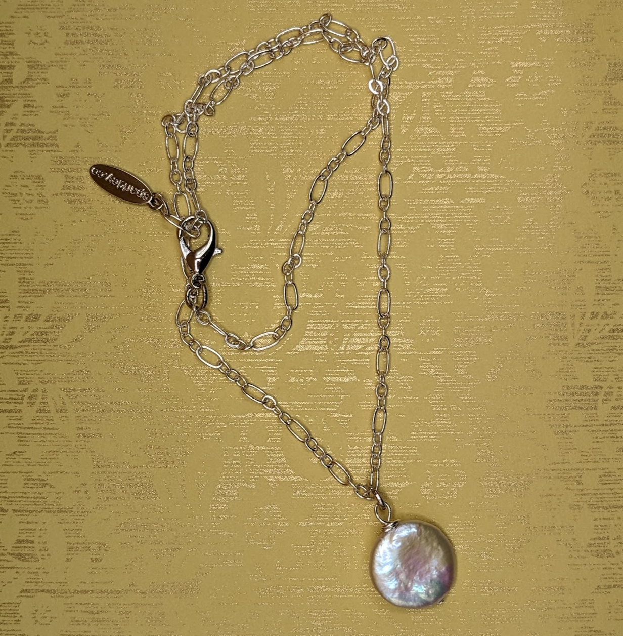 Coin pearl pendant necklace.